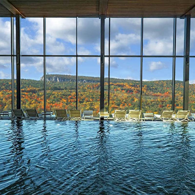 Indoor pool at the luxury building with a beautiful autumn view of upstate NY