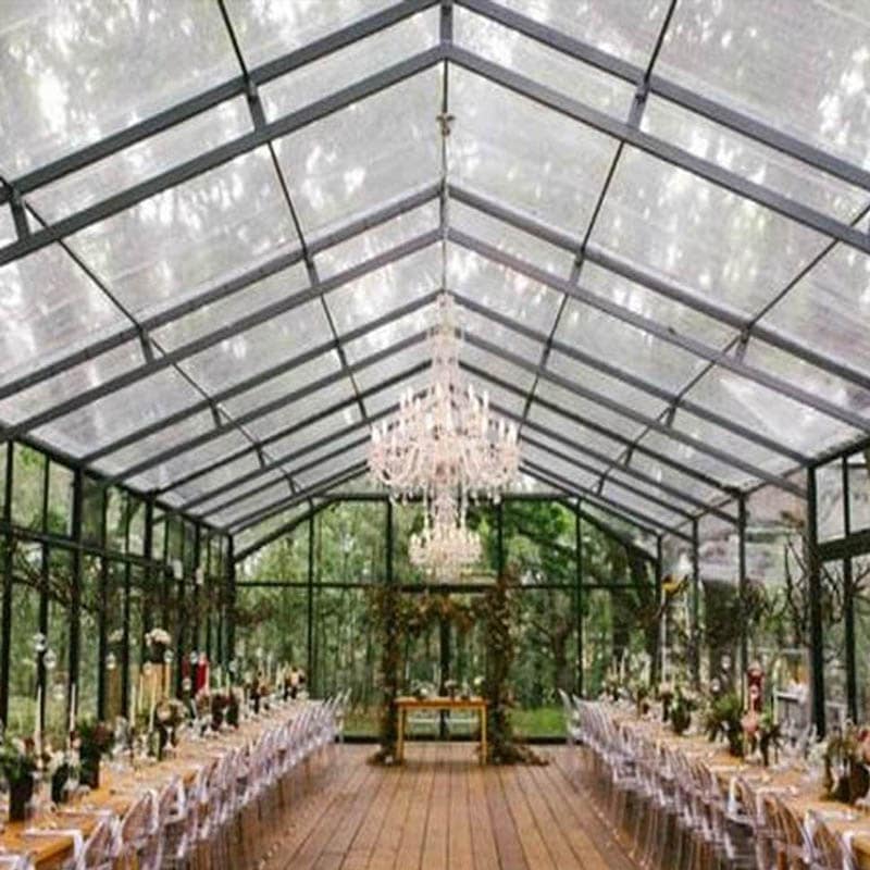 Stunning clear tent set up for a wedding in the woods
